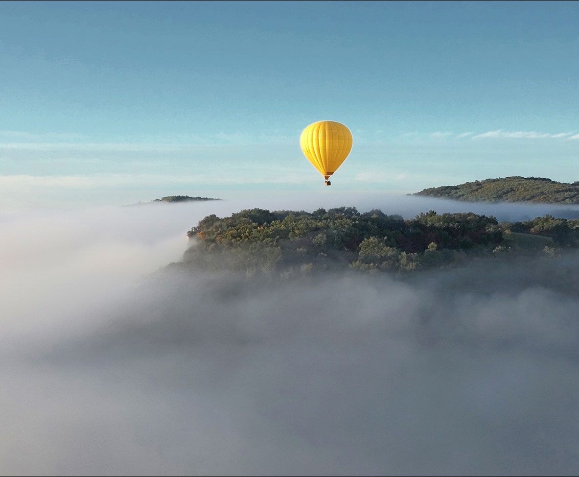 A hot air balloon over the mountains